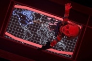 Chucky stands on top of a world map in Chucky Episode 306.